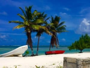 colorful fishing boats against the bluest sky you ever saw in xcalak - how Mexico changed me for the better