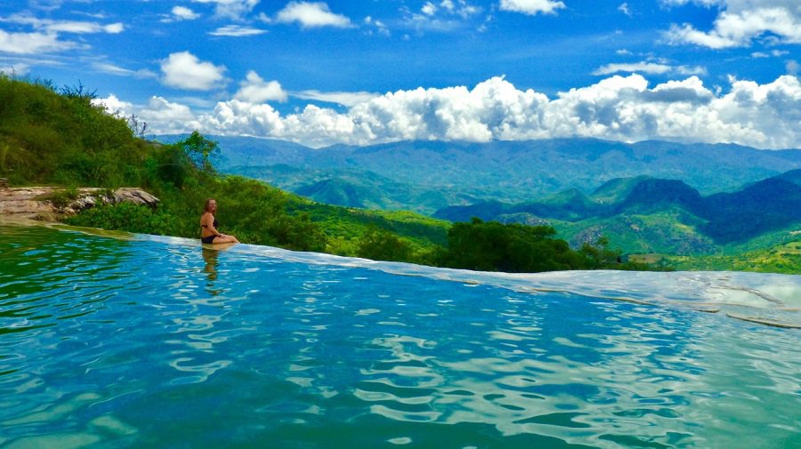 Ellen watches clouds go by from the infinity pool filled with mineral water in central Oaxaca, Mexico.