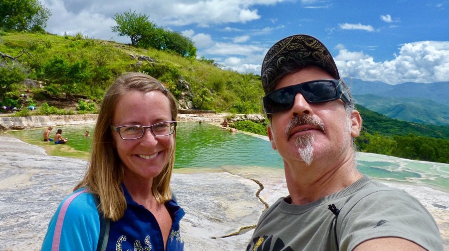 Ellen and Theo smile at an infinity pool filled with mineral springs at Hierve el Agua.