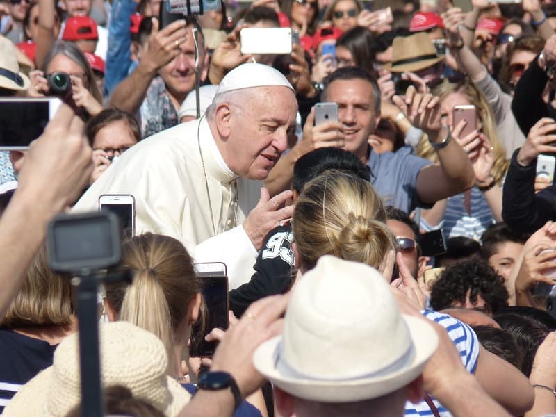 Pope Francis blesses someone in the crowd at St. Peter's square