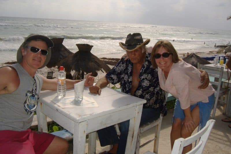 three people at an oceanfront cafe in Tulum, Mexico
