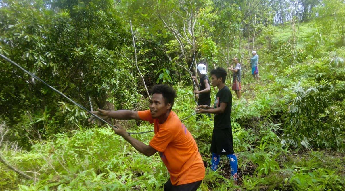 ati work on the electricity community project in the jungle on their land in malay, aklan, philippines