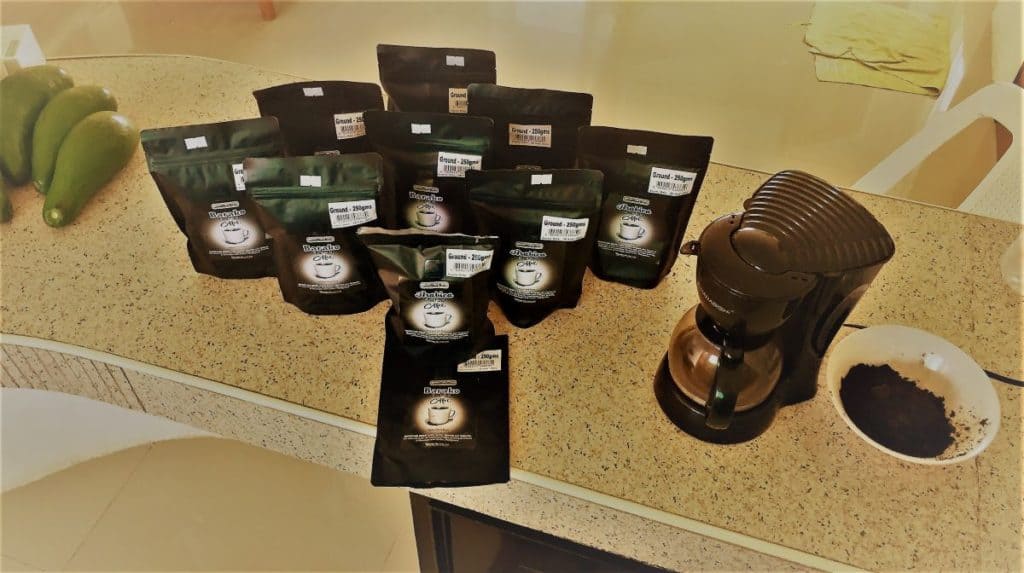 10 packages of ground coffee on the counter give a pandemic lesson on enoughness