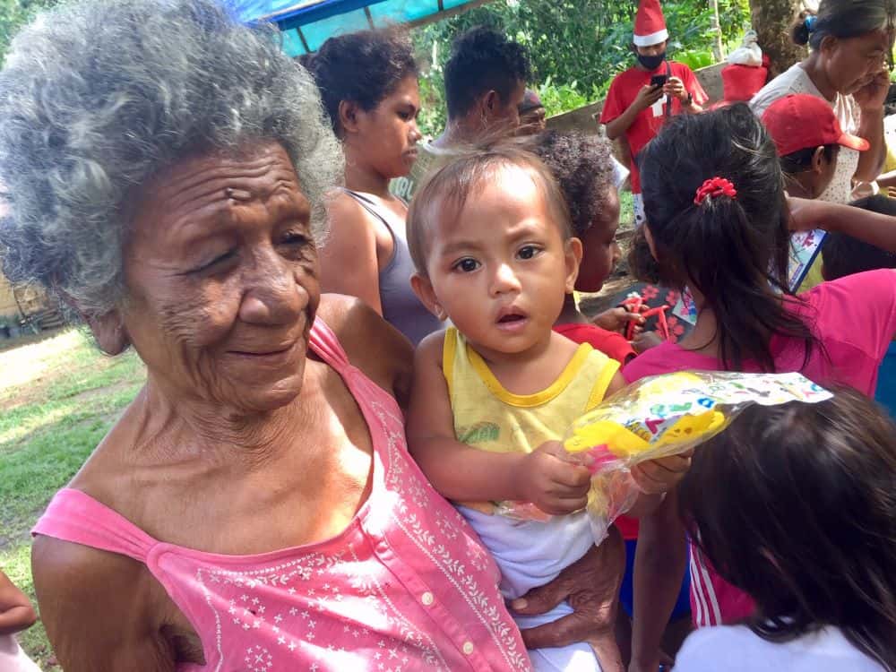 Grandma and child at the early Christmas delivery for the Ati tribe in Malay, Philippines.