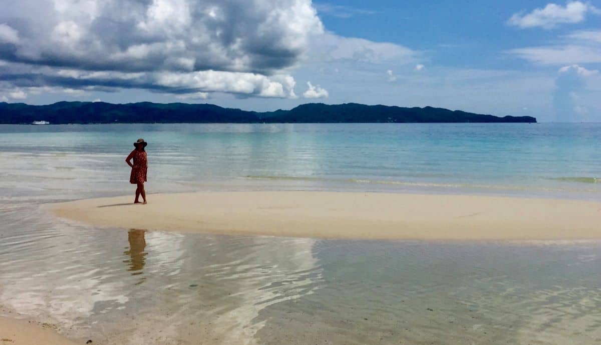 Ellen stands on a tidal sand bar on Boracay Island in the Philippines.