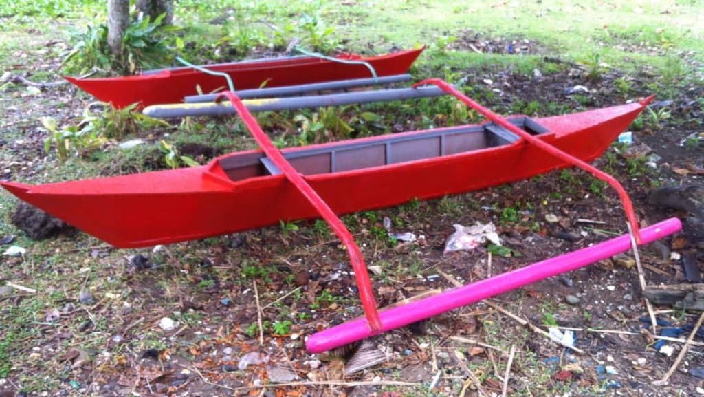 Two refurbished Ati fishing boats docked on land.