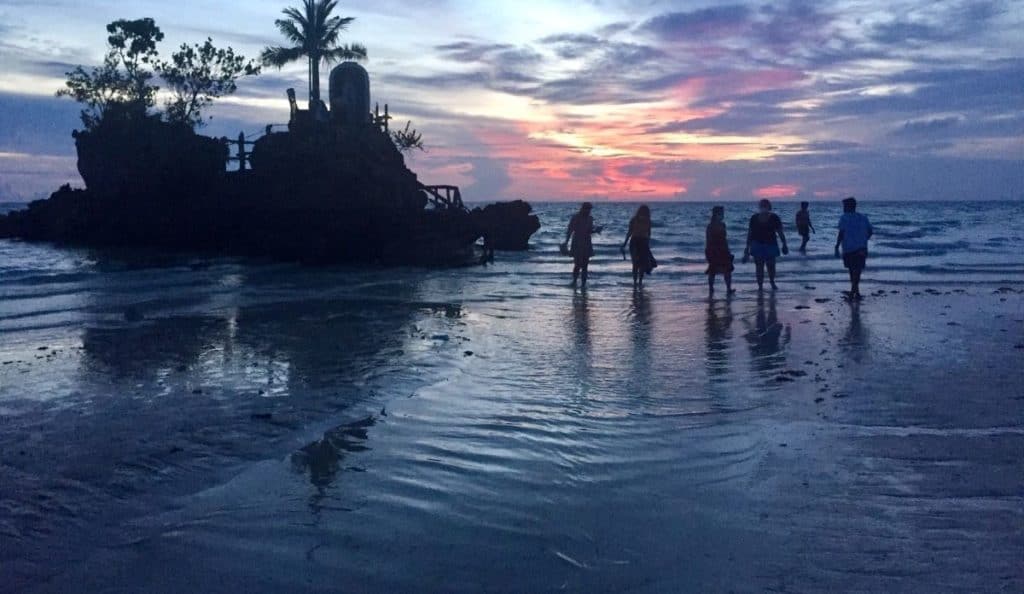 Tourists at the famous Willy's Rock on Boracay Island in the Philippines.