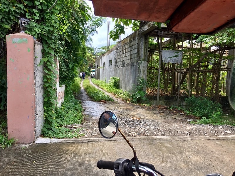 A dirt road that leads to the Bureau of Quarantine Kalibo location in the Philippines before the offices moved to a new building.