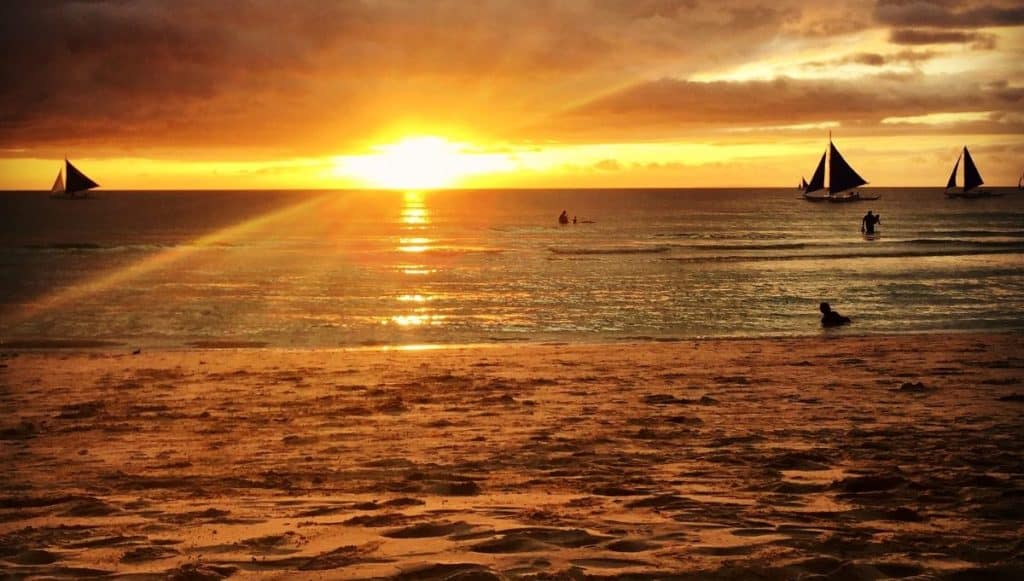 Sunset on Boracay Island with sailboats.