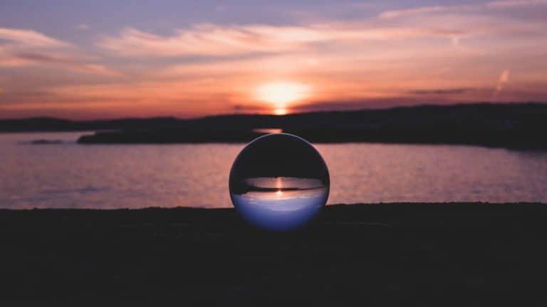A crystal ball on a beach at sunset gets Ellen thinking about travel predictions - and whether they came true.