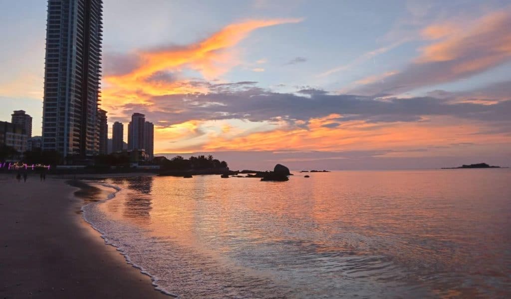 Beach at sunset in Penang, Malaysia, in 2022.