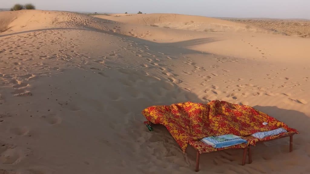 empty beds in the desert near jaisalmer, india