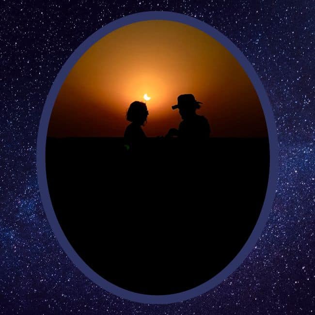 couple in front of a partial solar eclipse at a night sky tourism event in jaipur