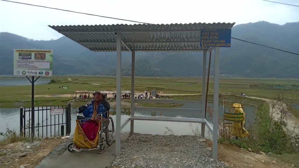ganesh under his new roadside shelter in pokhara, nepal, donated by earth vagabonds