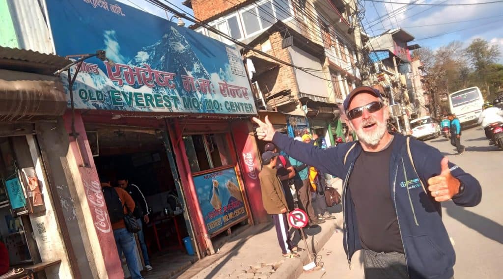 theo in front of old everest momo restaurant in kathmandu, nepal