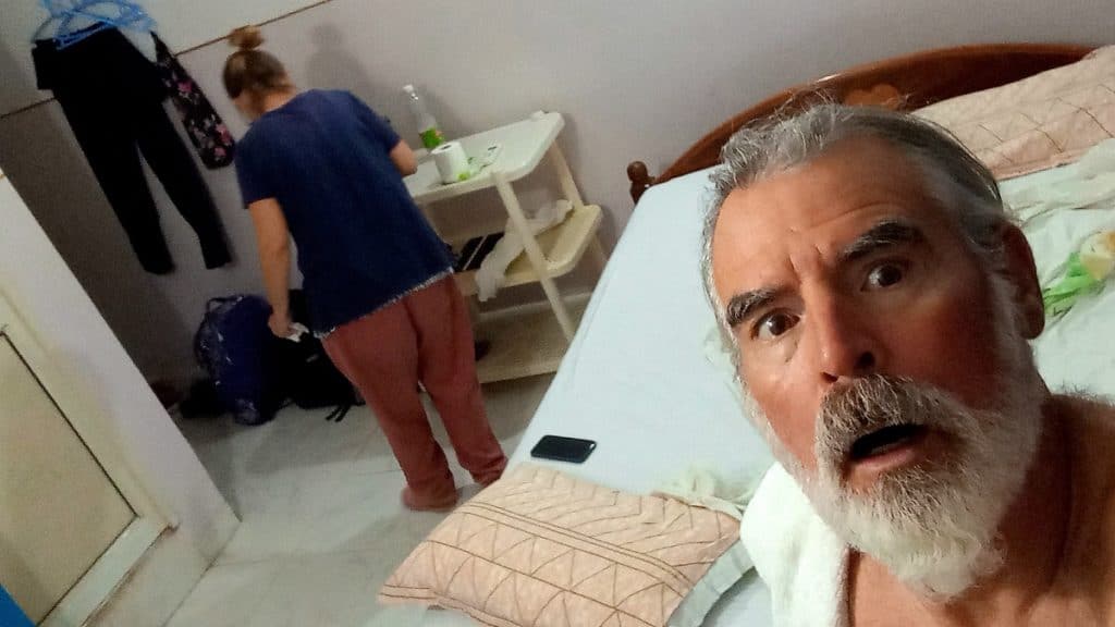 theo looks horrified by the mosquito massacre in a bodhgaya hotel room